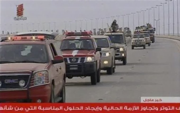 This screen grab taken from Bahrain TV shows troops arriving in Bahrain from Saudi Arabia on Monday, March 14.